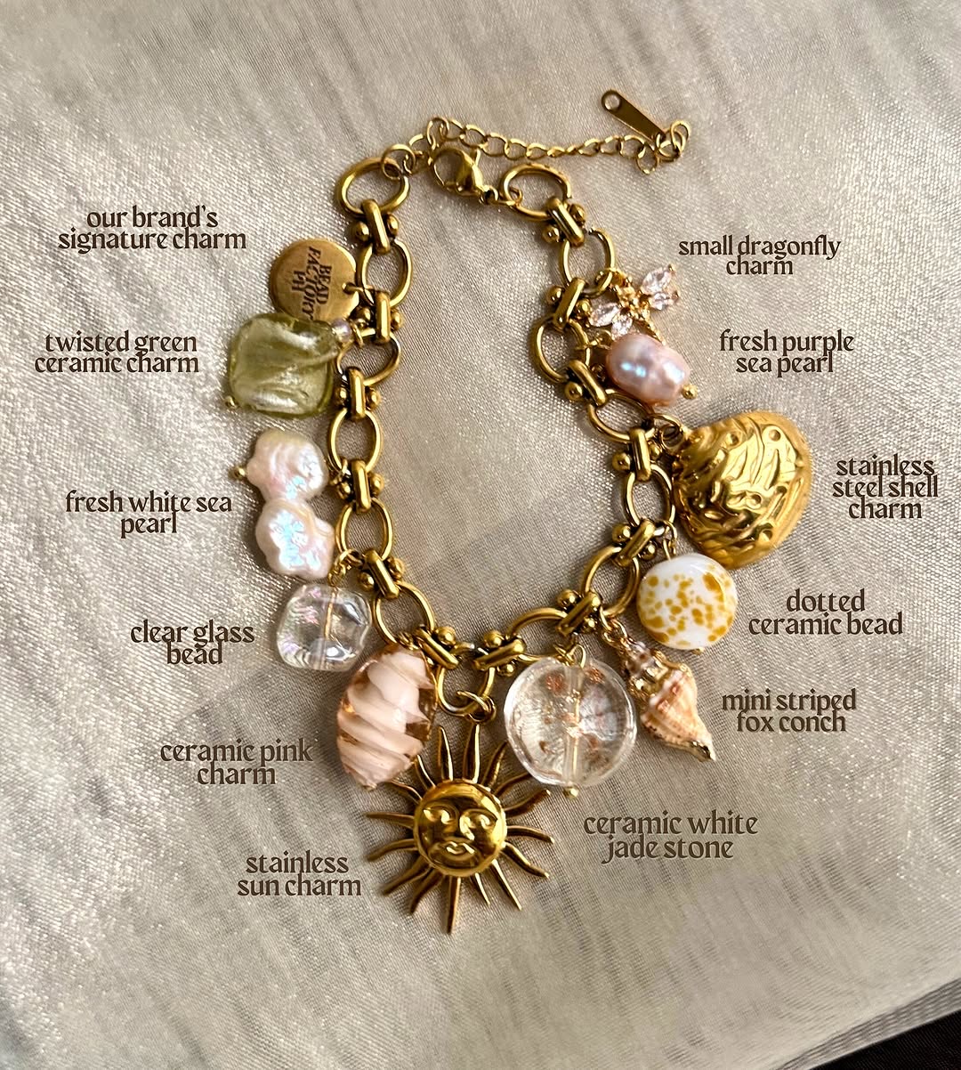 Signature charm bracelet with sea pearls, ceramic beads, and sun charm