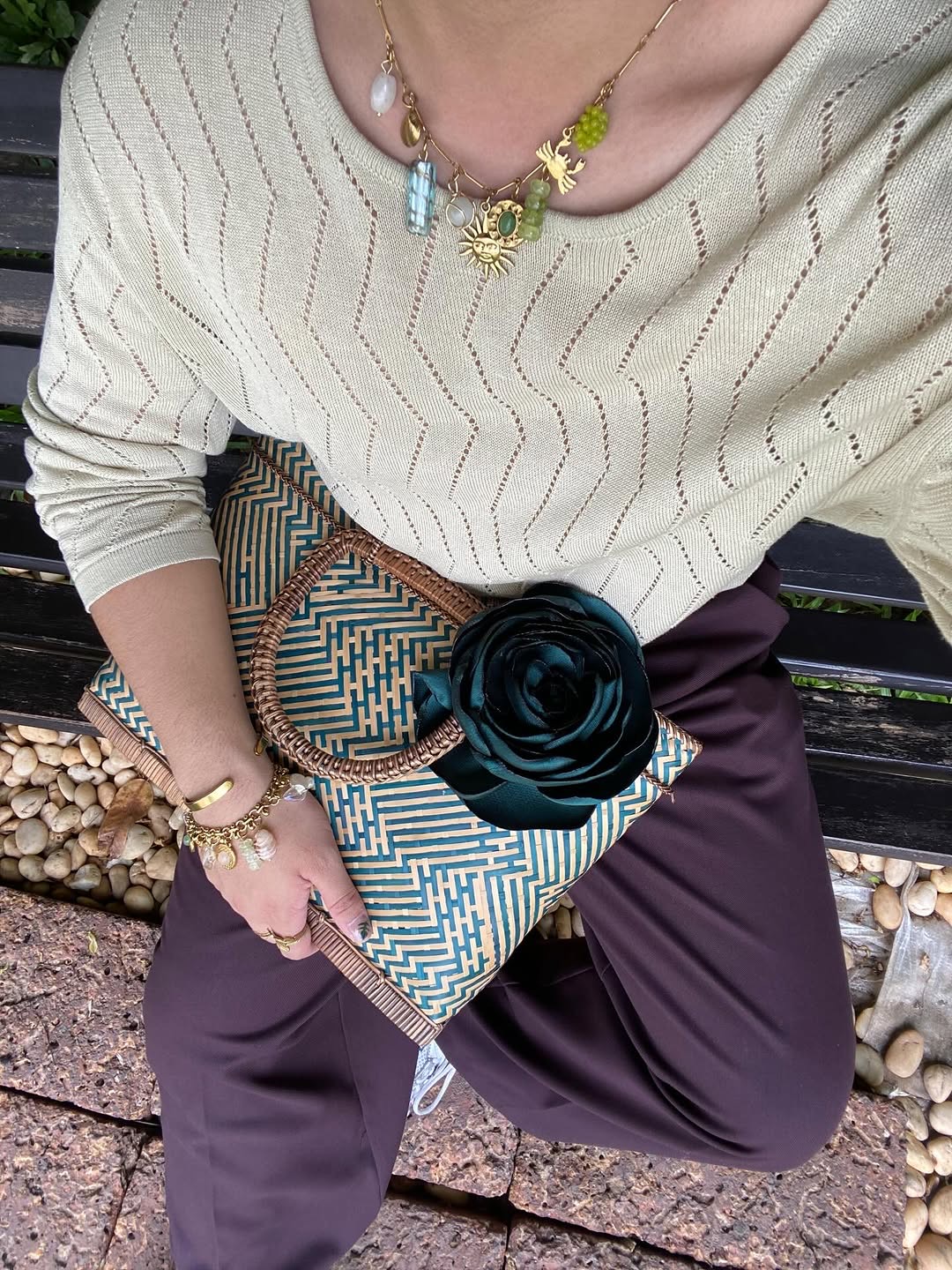 Person wearing Bead Factory PH charm necklace outdoors
